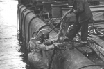 Patch the hull and pump out.